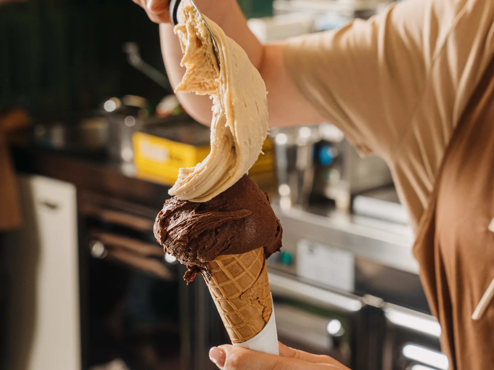 An artisan gelato cone served at the Dispenseria counter